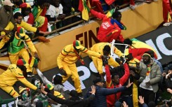 Senegal supporters clash with security forces after a penalty was awarded against their team