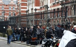 The media waits outside the High Court in London on the first day of Harry's case against a top UK newspaper publisher