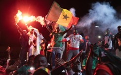 Football supporters celebrate at a 'fan zone' in Dakar on Sunday after Senegal won the Africa Cup of Nations final