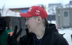Greenlander Aqqalu Petersen wears his 'Make America Go Away' hat with pride