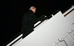 US President Donald Trump boards Air Force One at Joint Base Andrews on January 20, 2026