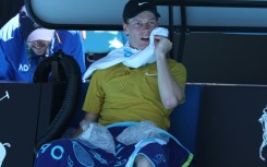 Italy’s Jannik Sinner uses ice packs between games against Eliot Spizzirri at the Australian Open