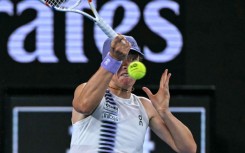 Poland's Iga Swiatek hits a shot against Russia's Anna Kalinskaya