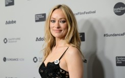 Olivia Wilde wore an 'ICE Out' badge when she attended the premiere of her new movie 'The Invite' at the Sundance Film Festival