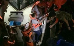 Survivors of the sunken M/V Trisha Kerstin 3 ferry are transferred to another ship in waters off Basilan province in this handout photo provided by the Philippine Coast Guard