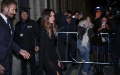 Victoria Beckham and her husband David Beckham leave a Paris ceremony after she was made a Knight of the Order of Arts and Letters