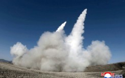 This picture taken on January 27, 2026 and released by North Korea's official Korean Central News Agency (KCNA) on January 28, 2026 shows a test firing of the renewed large-caliber rocket launcher system