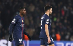 Paris Saint-Germain's Ousmane Dembele (L) and Goncalo Ramos pictured at the end of Wednesday's 1-1 draw with Newcastle United which condemned both teams to have to enter the knockout phase play-offs in this season's Champions League