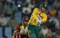 South Africa's Quinton de Kock (R) hit six fours and 10 sixes in making a career-best 115 off 49 deliveries