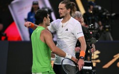 Spain's Carlos Alcaraz and Germany's Alexander Zverev embrace after their Australian Open semi-final
