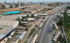 Malian tankers wait to load fuel at the Ivorian Refining Company (SIR) in Abidjan on January 15, 2026