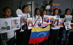 Relatives rally for the release of political prisoners outside the El Helicoide, headquarters of the Bolivarian National Intelligence Service (SEBIN), in Caracas on January 30, 2026