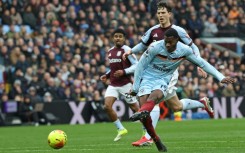 Brentford striker Dango Ouattara shoots against Aston Villa