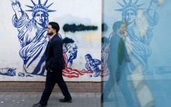 A mural depicting the Statue of Liberty with its torch-bearing arm broken, on the wall of the former US embassy in Tehran