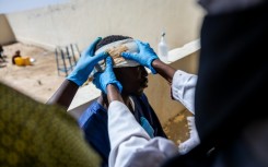 Sudanese refugee Mahamat Hamid Abakar, 33, was wounded in a drone strike, like many crossing into Chad