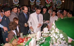 Saddam enjoying a birthday cake in 2000