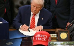 US President Donald Trump signs a funding bill ending a partial government shutdown