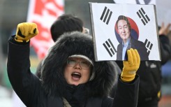 A supporter of South Korea's former president Yoon Suk Yeol in front of the Seoul Central District Court earlier this year.