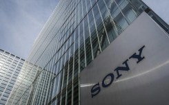 Japanese giant Sony hiked its full-year net profit as a weaker yen compensates for its ageing PlayStation games console and a memory chip crunch