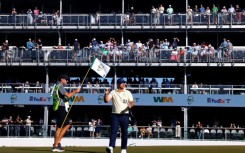 American Chris Gotterup acknowledges the crowd on the 16th green on the way to the first-round lead in the US PGA Tour Phoenix Open