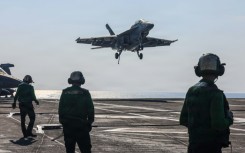 A US naval battle group led by the aircraft carrier USS Abrahem Lincoln is in waters near Iran. (Handout photograph)