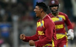 West Indies' Gudakesh Motie celebrates after taking the wicket of England's Tom Banton