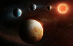 This artist's impressions shows the unusual set up of the solar system around the LHS 1903 star