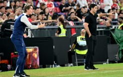 Thomas Frank (L) and Mikel Arteta (R) gesture from the touchline during a pre-season friendly between Tottenham and Arsenal in Hong Kong