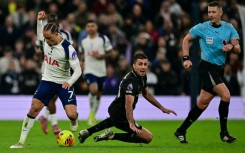 Manchester City midfielder Rodri (C) in action against Tottenham