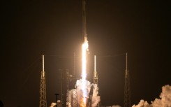 A SpaceX Falcon 9 rocket with the company's Dragon spacecraft on top launches from Cape Canaveral, en route to the International Space Station