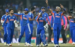 India's Hardik Pandya (R) celebrates with teammates after their win against Pakistan