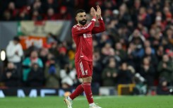 Scorer Mohamed Salah applauds Liverpool supporters after being substituted in an FA Cup victory over Brighton at Anfield.