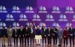 India's Prime Minister Narendra Modi (C) takes a group photo with AI company leaders at the AI Impact Summit in New Delhi on February 19, 2026