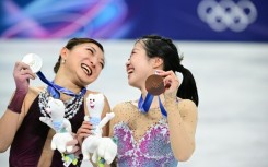 Japan's Kaori Sakamoto (L) with her Olympic figure skating silver medal and 17-year-old teammate Ami Nakai (R) with her bronze