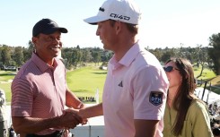 American Jacob Bridgeman is congratulated by tournament host Tiger Woods after winning the PGA Tour Genesis Invitational at Riviera Country Club