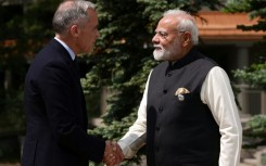 Canadian Prime Minister Mark Carney greets Indian Prime Minister Narendra Modi at a G7 meeting last year in western Canada