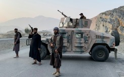 Taliban security personnel stand guard near the Torkham border crossing between Afghanistan and Pakistan in the Nangarhar province