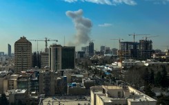 Smoke rose above Tehran after explosions were heard
