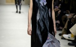 Distressed or "eaten away" fabrics were prevalent at Prada during Milan Fashion Week.