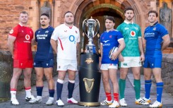 Wales' Dewi Lake, Scotland's Sione Tuipulotu, England's Jamie George, France's Antoine Dupont, Ireland's Caelan Doris, and Italy's Michele Lamaro pose with the trophy in January before the accident