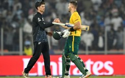 Aiden Markram (right) is congratulated by New Zealand counterpart Mitchell Santner after South Africa won their group phase clash in Ahmedabad on February 15