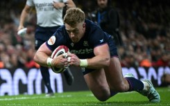 Scotland wing Kyle Steyn dives over the line to score a try during a 26-23 Six Nations win away to Wales in Cardiff