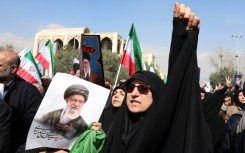 People hold portraits of Iran's slain supreme leader Ayatollah Ali Khamenei as they take part during an anti US-Israel demonstration after Friday prayer in Tehran on March 6