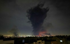 Smoke rises from Mehrabad International Airport in Tehran as the Mideast war enter its second week