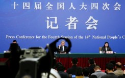 China's Foreign Minister Wang Yi, who is also a member of the Political Bureau of the Communist Party of China Central Committee, attends a press conference in Beijing