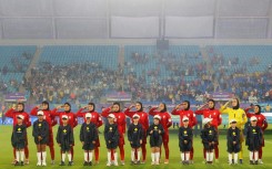 Iranian players salute during the national anthem before their AFC Women's Asian Cup match against the Philippines in Gold Coast