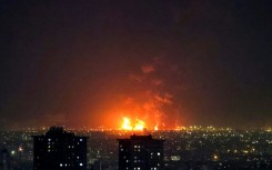 Fire lights up the sky in Tehran as Iranian oil refineries are hit during the US-Israeli campaign