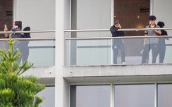 Members of the Iranian women’s football team are seen on their respective room balconies at the Royal Pines Resort on the Gold Coast on March 9, 2026