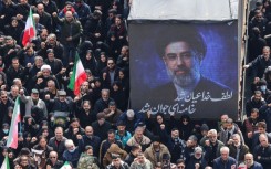 A screen displays a portrait of Iran's new supreme leader Mojtaba Khamenei during the funerals of Iran's Revolutionary Guards Corps (IRGC) commanders, army commanders and others killed in the early days of the United States and Israeli strikes on Iran, at Enghelab Square in Tehran on March 11, 2026
