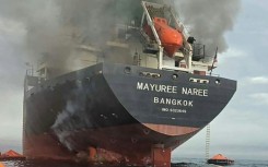 A Thai vessel, the Mayuree Naree, caught fire after being hit by an unidentified projectile in the Strait of Hormuz